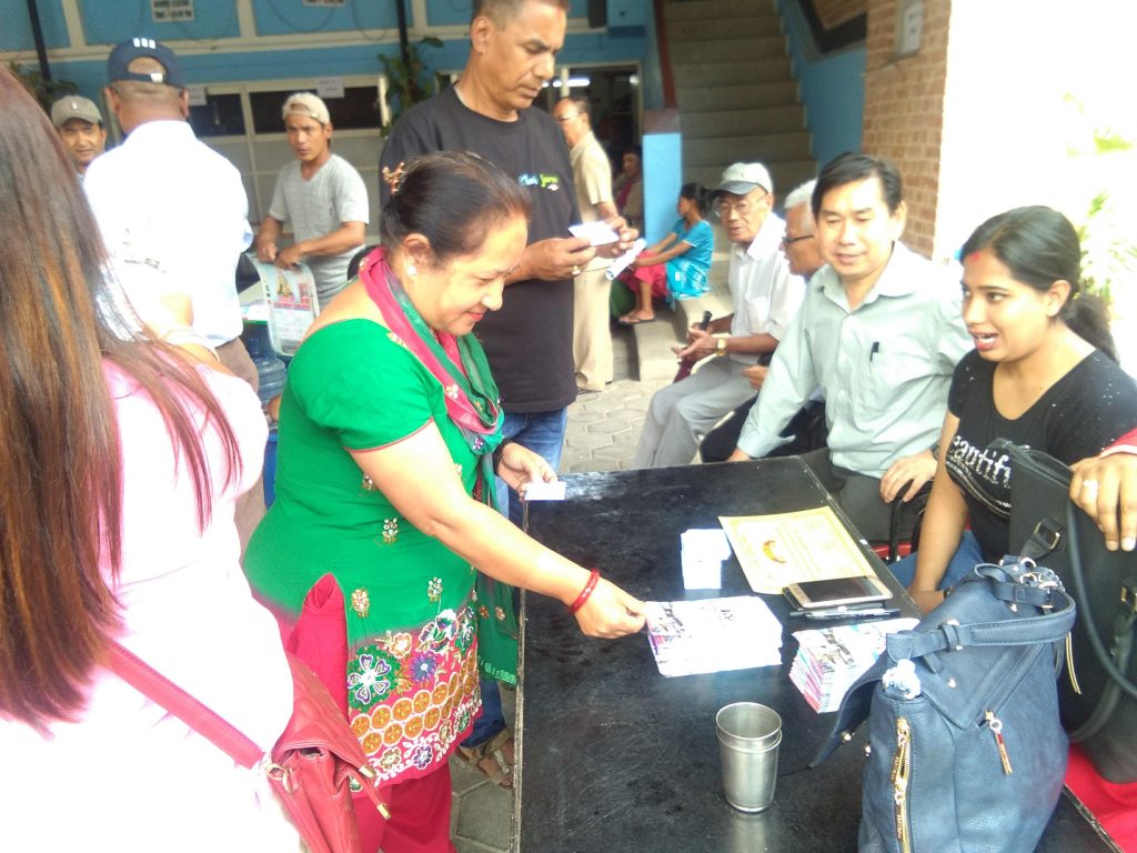 Staff assisting patients with glasses